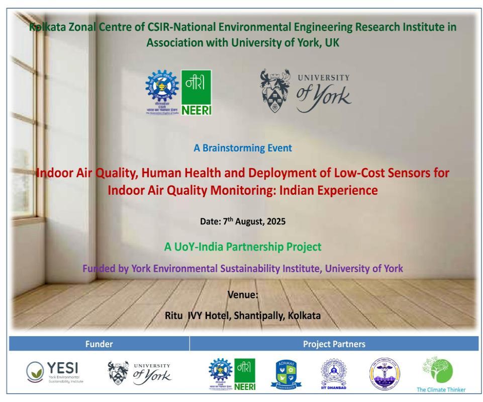 A room with white walls with wording and logos to advertise an event